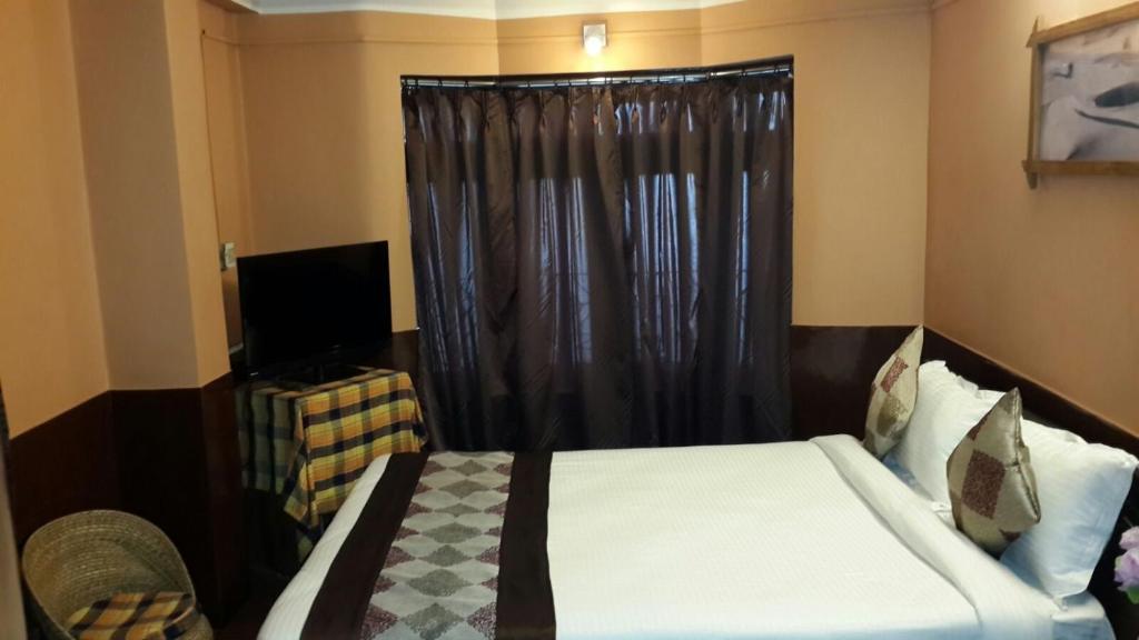 Postel nebo postele na pokoji v ubytování Hotel Payal