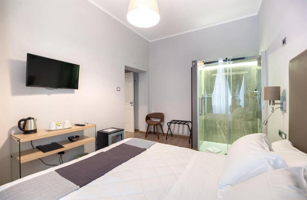 A bed or beds in a room at Clementi 18 Suites Rome