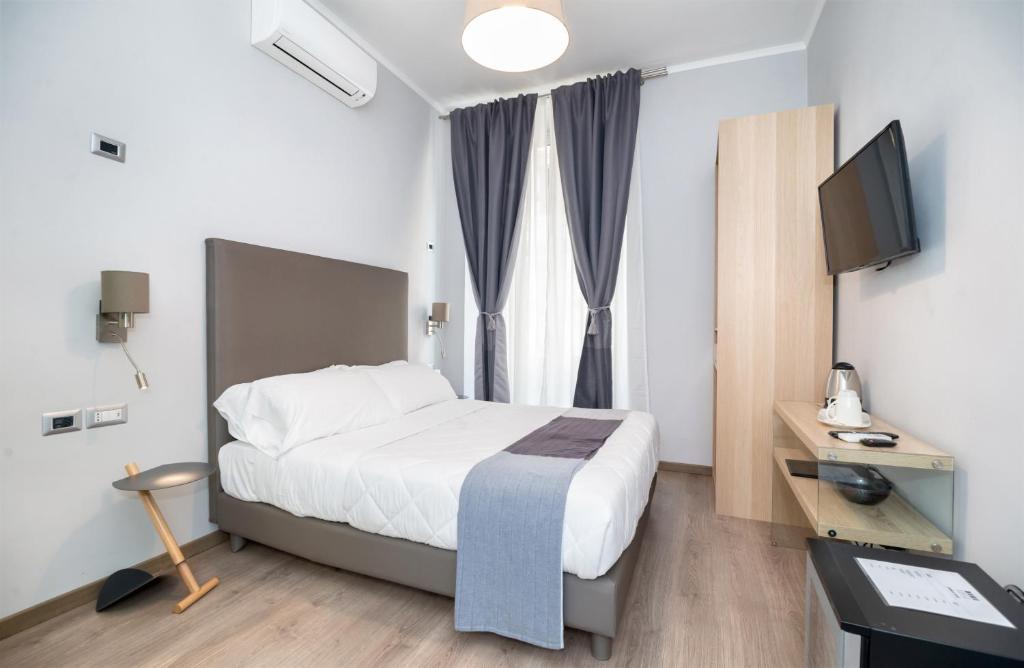A bed or beds in a room at Clementi 18 Suites Rome