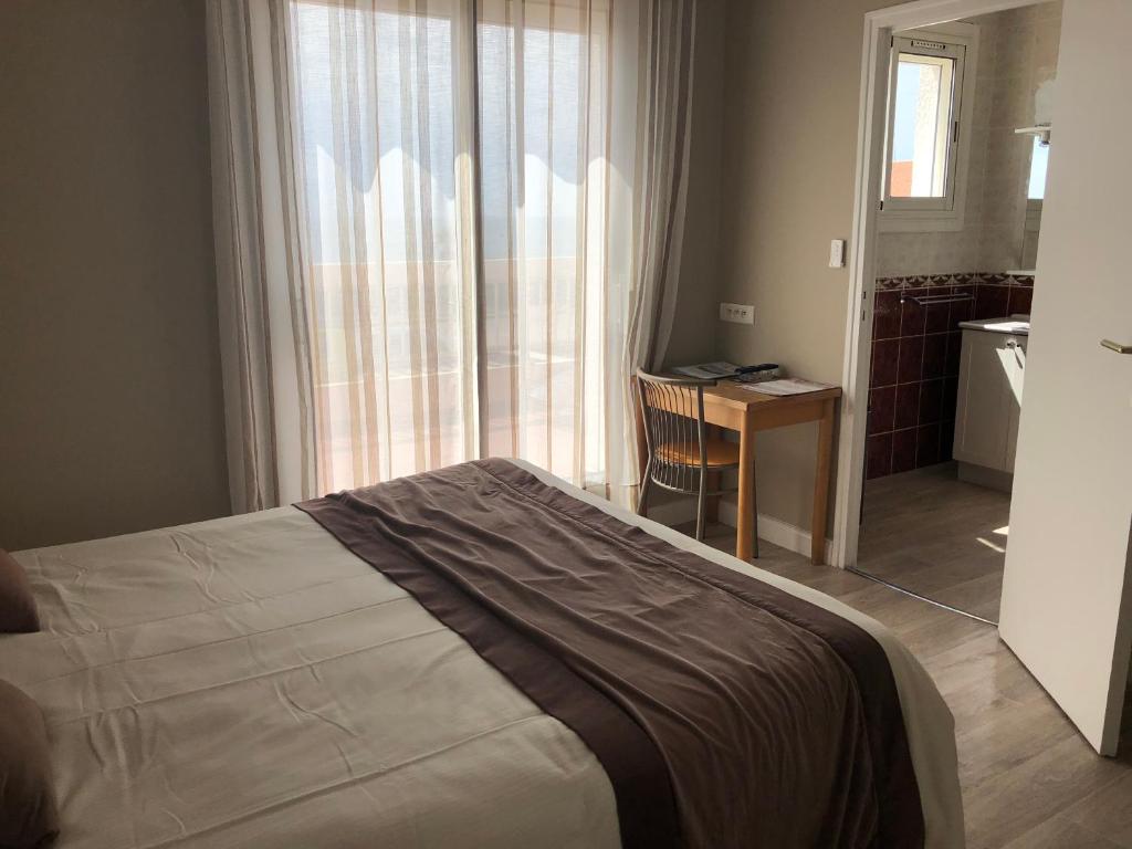 Postel nebo postele na pokoji v ubytování Logis Hotel Restaurant le Mirador