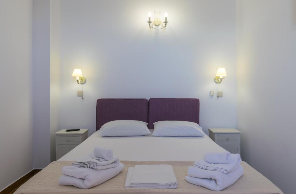 Postel nebo postele na pokoji v ubytování Malion Rooms