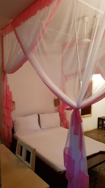 Postel nebo postele na pokoji v ubytování Makuti Villas Resort