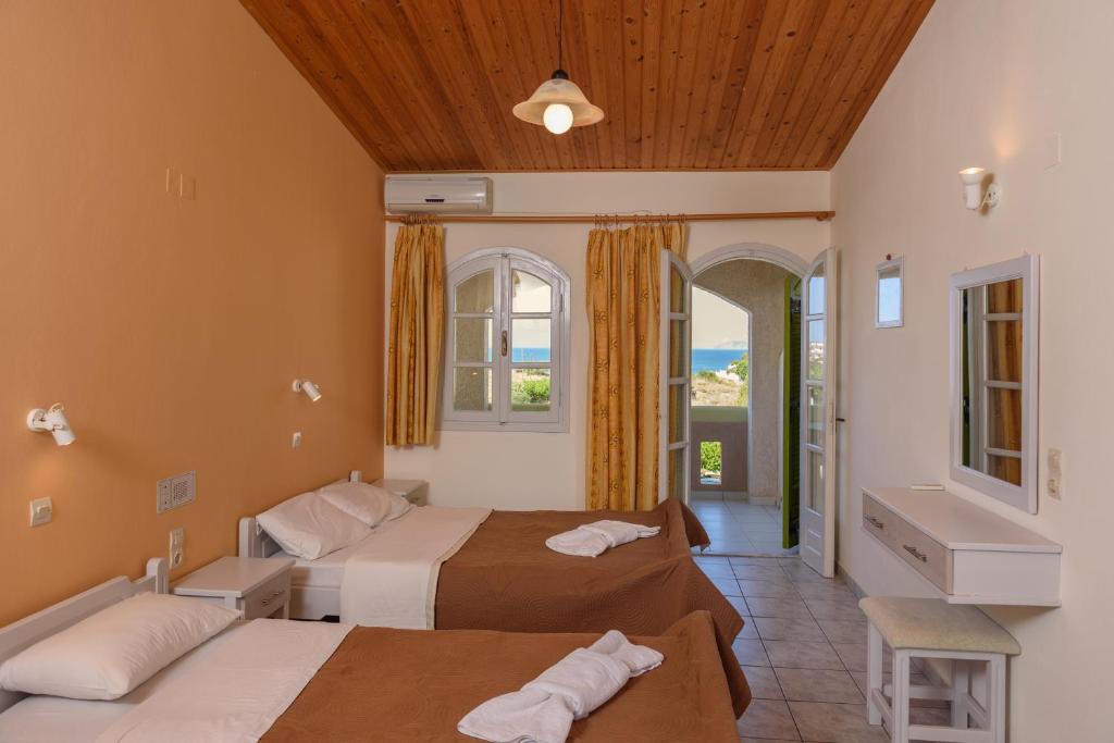 Postel nebo postele na pokoji v ubytování Hotel Kiklamino