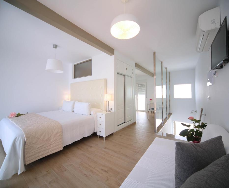Postel nebo postele na pokoji v ubytování Hotel Casa Rosa