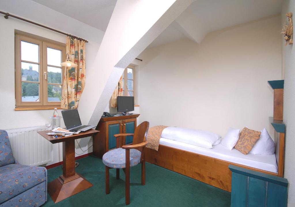 Postel nebo postele na pokoji v ubytování Hotel Saigerhütte