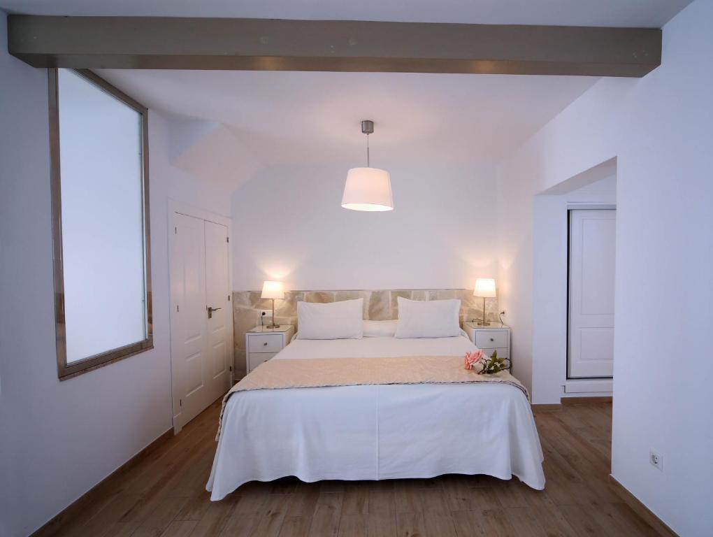 Postel nebo postele na pokoji v ubytování Hotel Casa Rosa