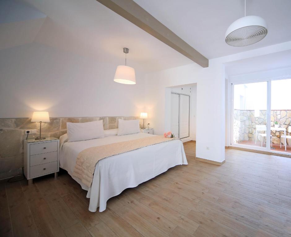Postel nebo postele na pokoji v ubytování Hotel Casa Rosa