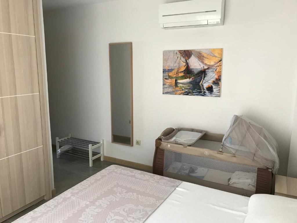 A bed or beds in a room at EVN Hotel