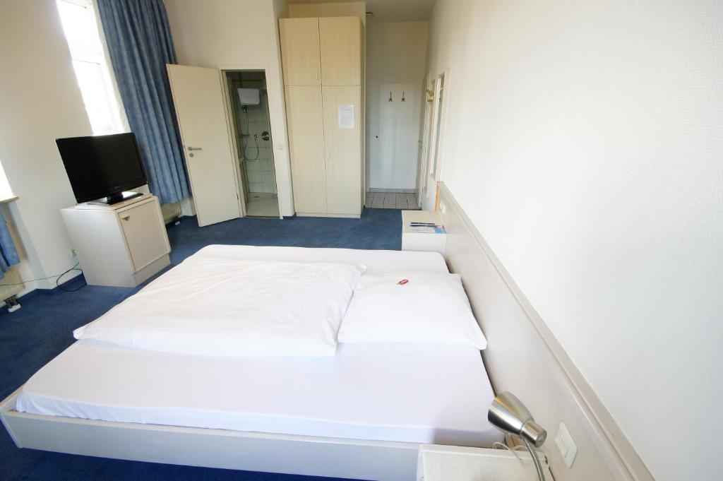 Postel nebo postele na pokoji v ubytování Hotel Neuwirtshaus
