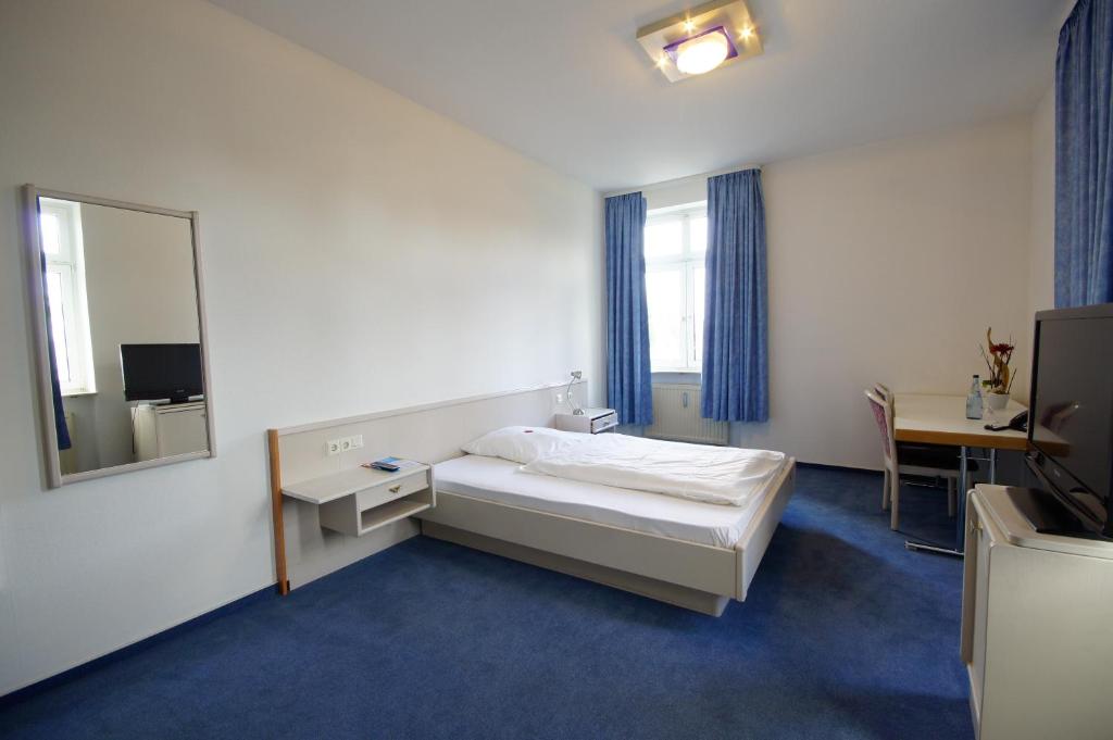 Postel nebo postele na pokoji v ubytování Hotel Neuwirtshaus