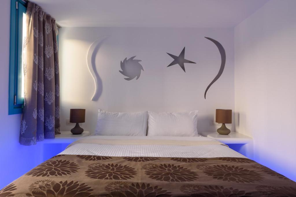 Postel nebo postele na pokoji v ubytování Nikolas Hotel