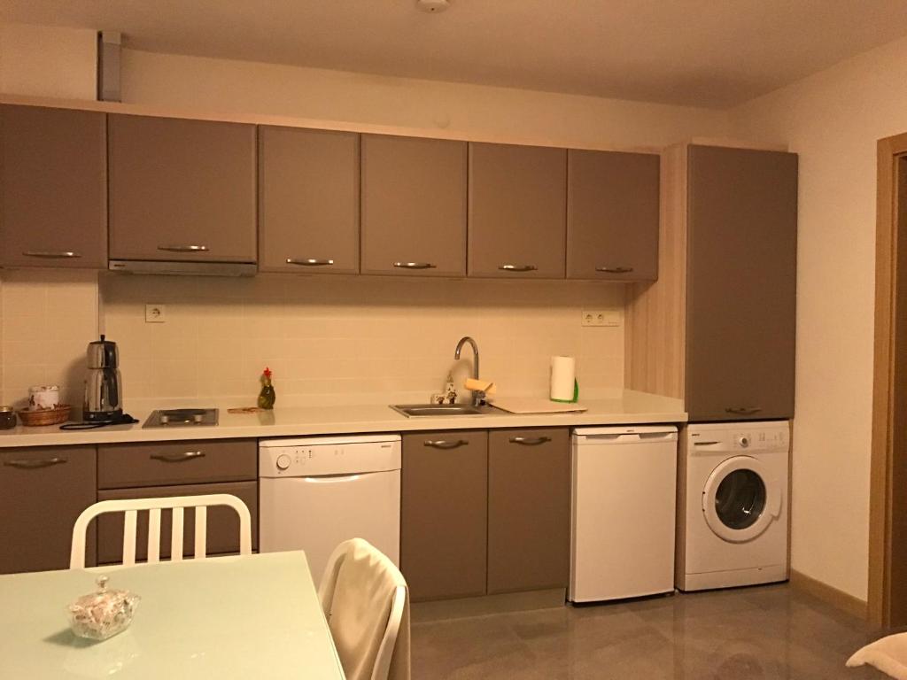 A kitchen or kitchenette at EVN Hotel