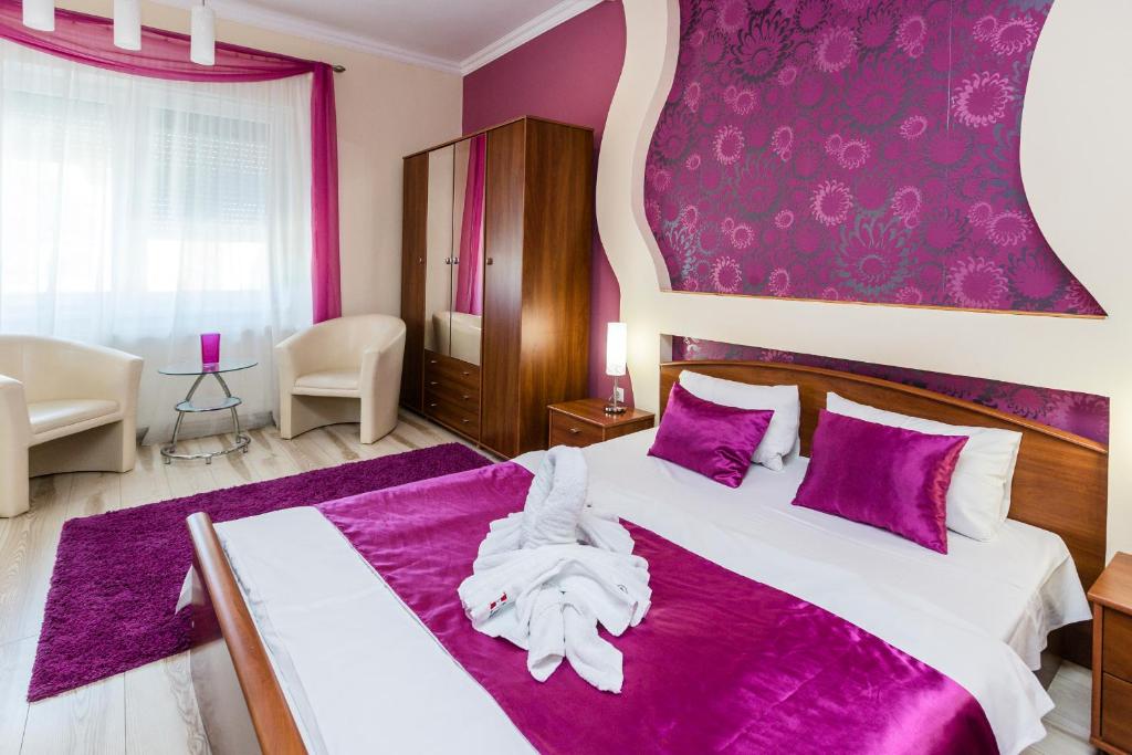 Posteľ alebo postele v izbe v ubytovaní Almafa Apartmanház