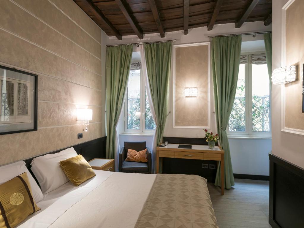 A bed or beds in a room at DK Suites