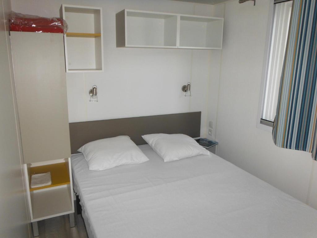 Postel nebo postele na pokoji v ubytování Camping l'Eléphant