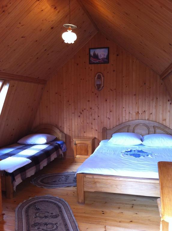 Postel nebo postele na pokoji v ubytování Sykytura