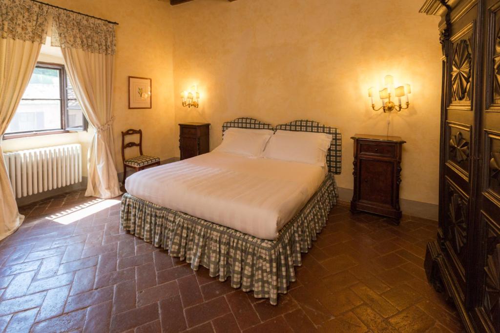 Postel nebo postele na pokoji v ubytování Badia a Coltibuono Wine Resort