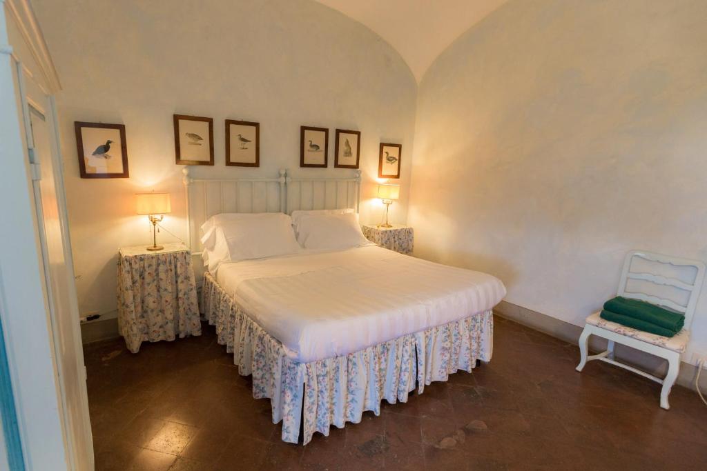 Postel nebo postele na pokoji v ubytování Badia a Coltibuono Wine Resort