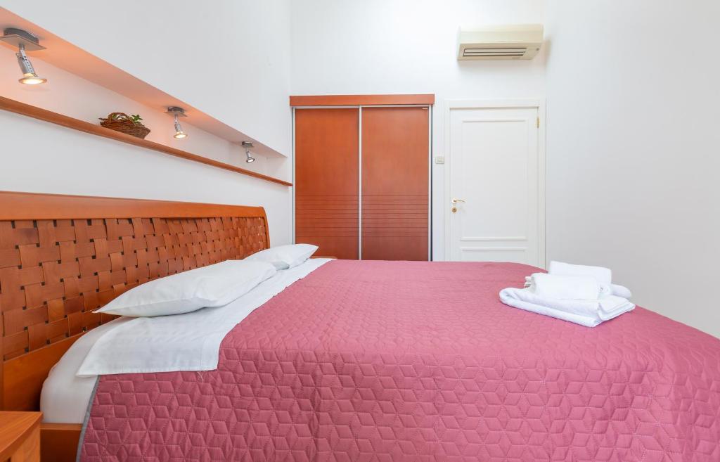 Posteľ alebo postele v izbe v ubytovaní Apartment Bona Palace