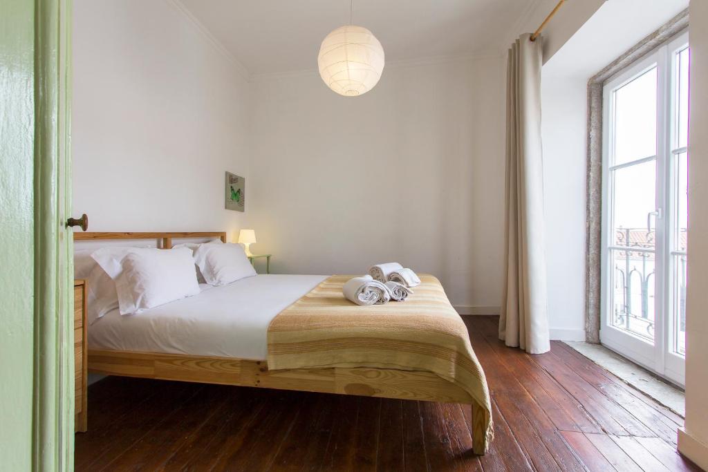 En eller flere senge i et værelse på Alfama Tailor Made Green House With a View #2