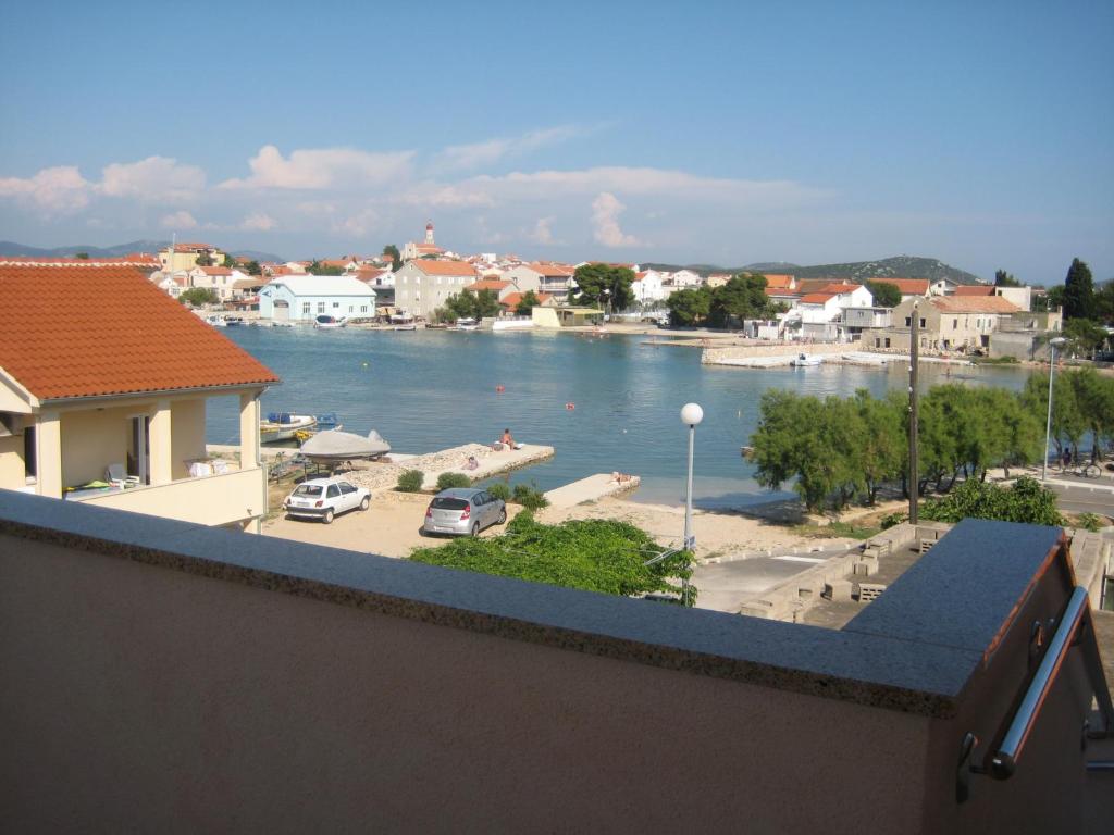 a view of a river from a balcony at Apartments Jakovčev in Betina