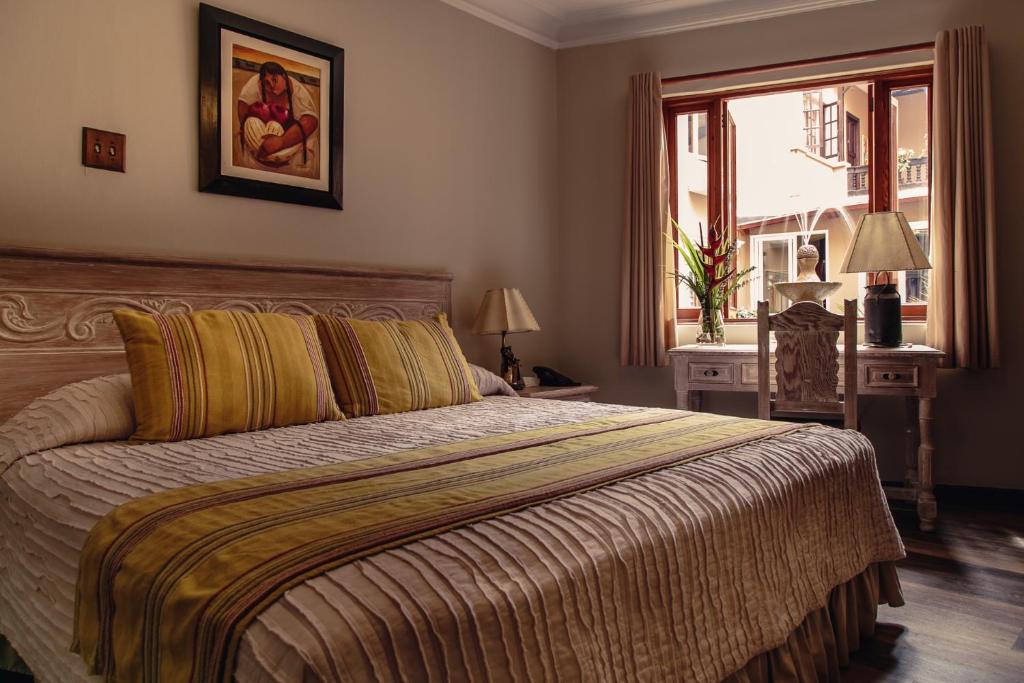Postel nebo postele na pokoji v ubytování Hotel Antigua Miraflores