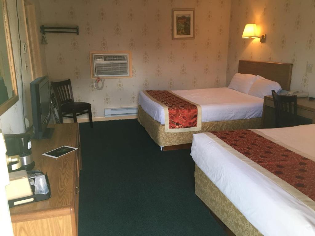 Postel nebo postele na pokoji v ubytování Motel 88