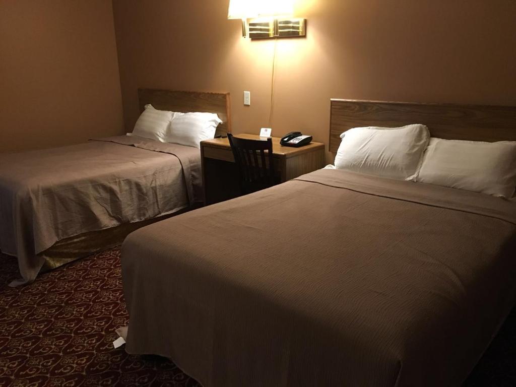 Postel nebo postele na pokoji v ubytování Motel 88