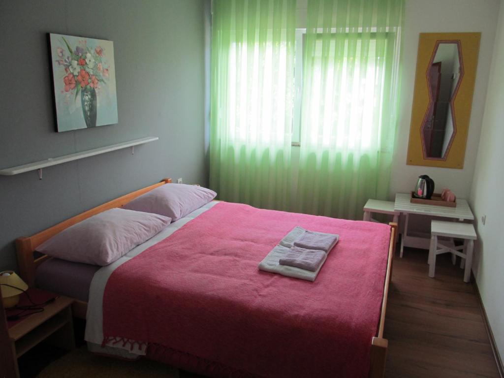 Posteľ alebo postele v izbe v ubytovaní Rooms Danica