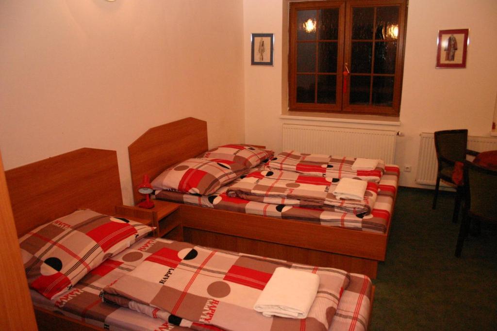 Postel nebo postele na pokoji v ubytování Penzion Pohoda