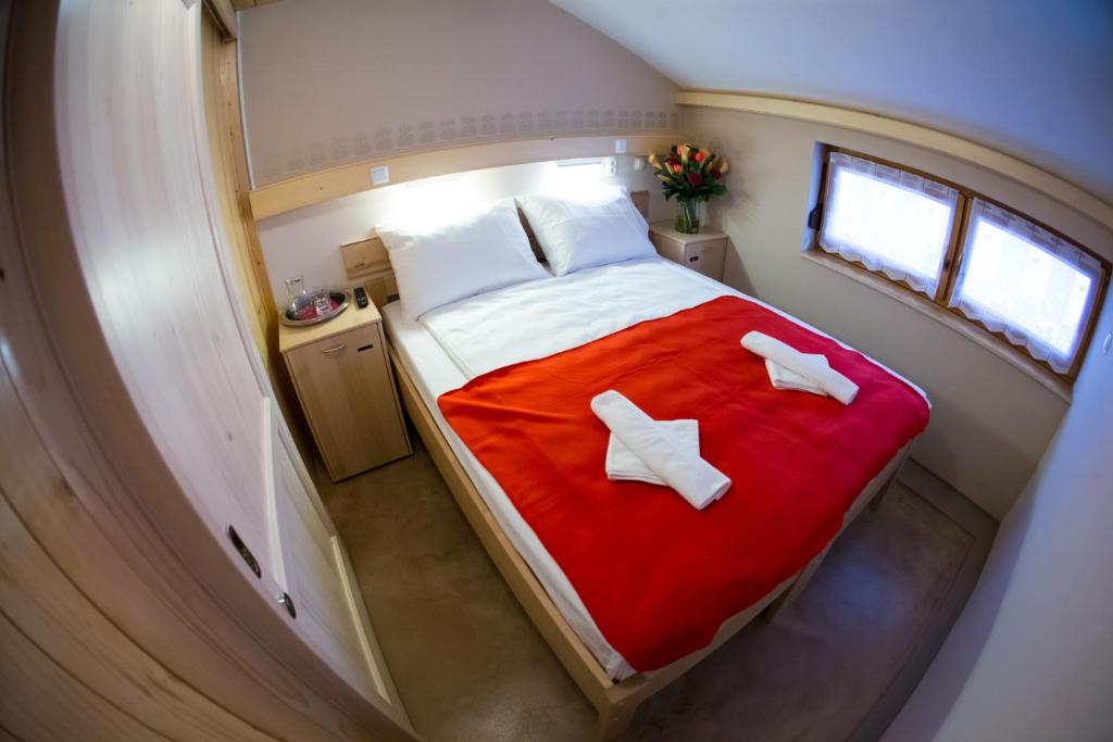 an overhead view of a bed in a small room at GLUTEN FREE Bed & Breakfast Dežela Okusov in Ljubljana