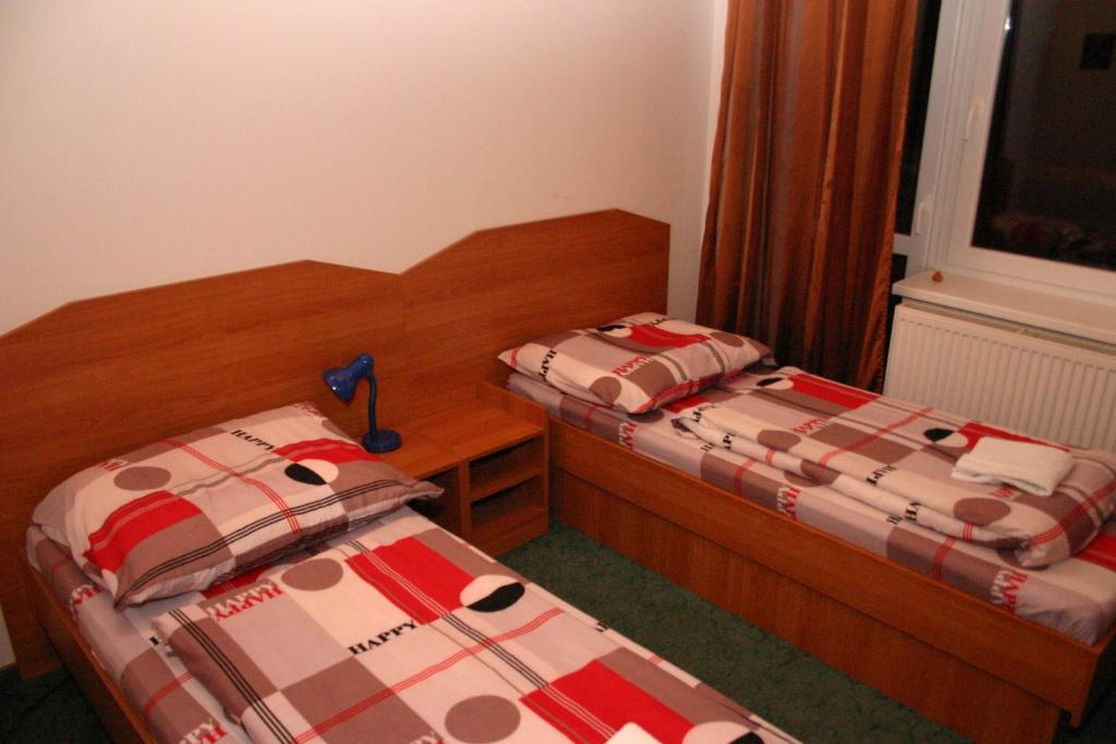 Postel nebo postele na pokoji v ubytování Penzion Pohoda