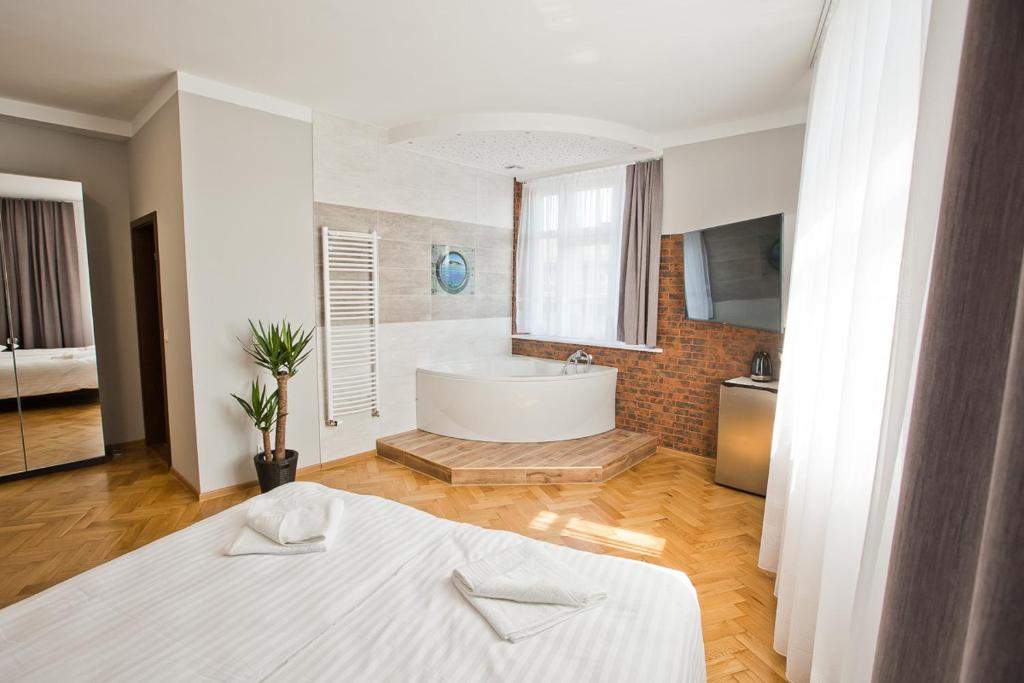 Posteľ alebo postele v izbe v ubytovaní R&B APARTMENTS POZNAŃ