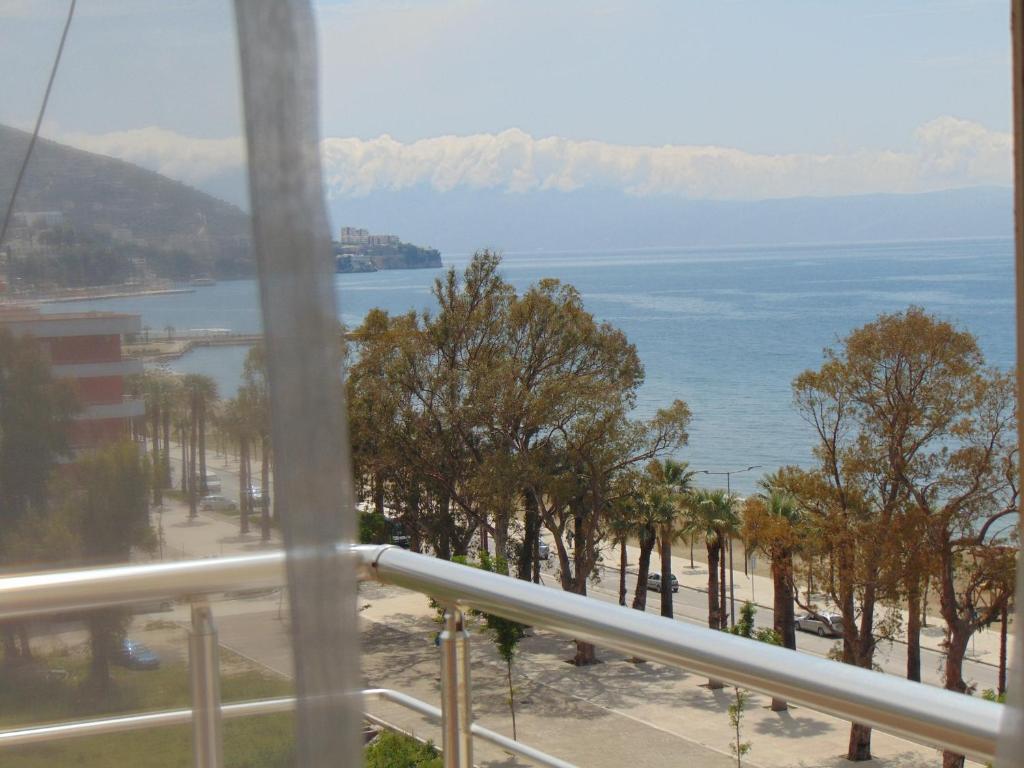 a view of the ocean from a balcony at Janine's Seafront Apartment in Vlorë