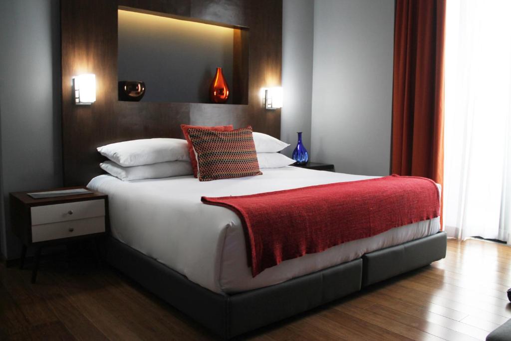 Postel nebo postele na pokoji v ubytování Hotel Love It CAS Consulado