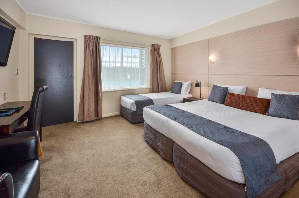 Postel nebo postele na pokoji v ubytování Poenamo Hotel