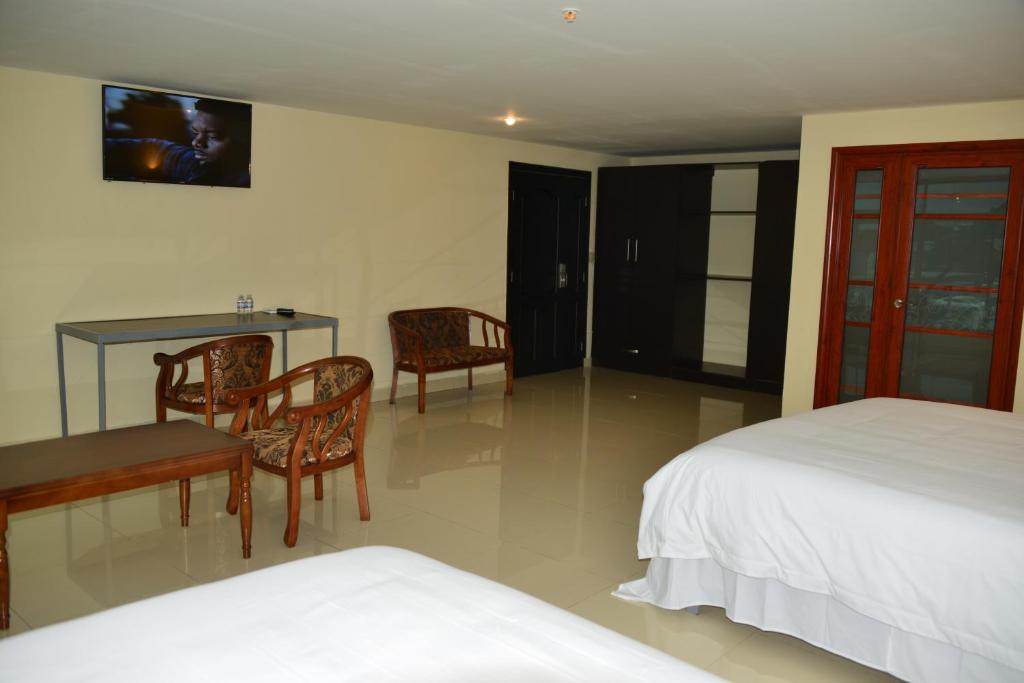 Voodi või voodid majutusasutuse Hotel F Sur Inn toas