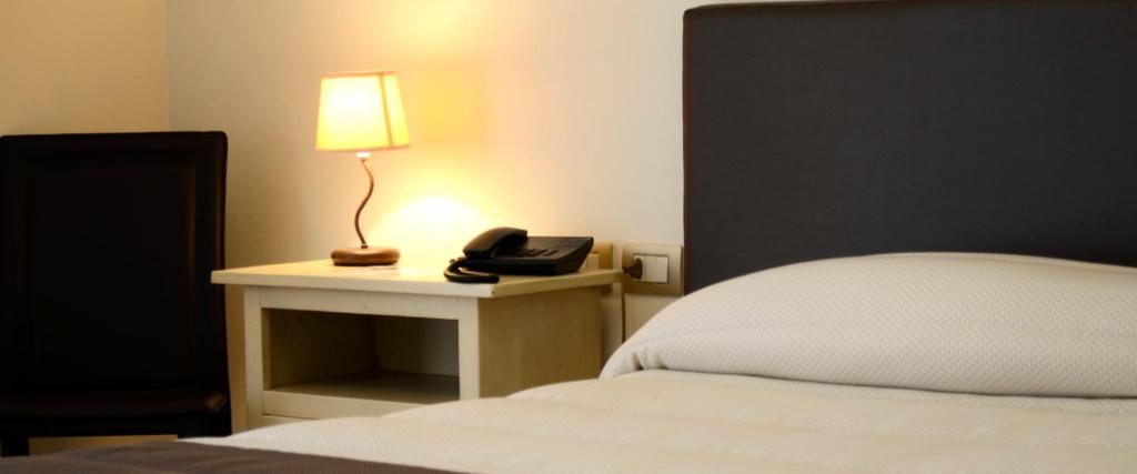 Postel nebo postele na pokoji v ubytování Hotel Il Cammino Di Francesco