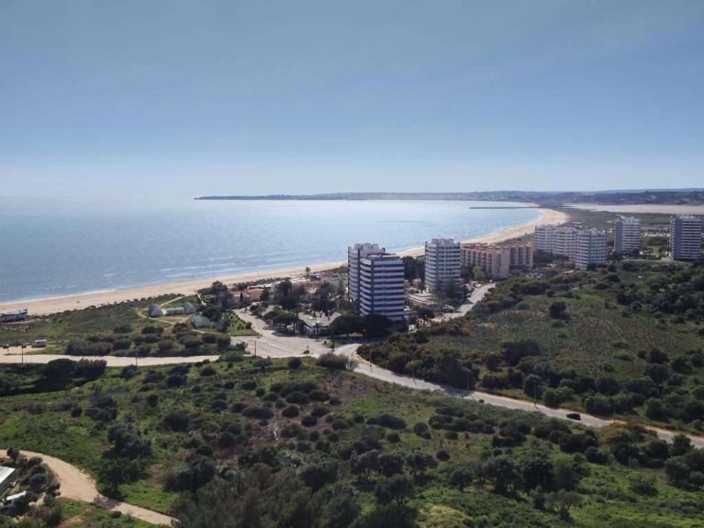 an aerial view of a beach and some buildings at Algarve Beachfront Alvor in Alvor