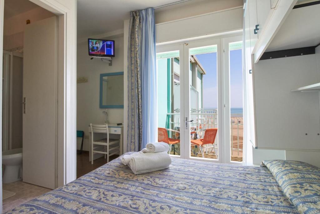 Postel nebo postele na pokoji v ubytování Hotel Sanremo