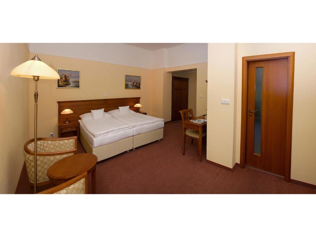 Postel nebo postele na pokoji v ubytování Wellness Hotel Ida