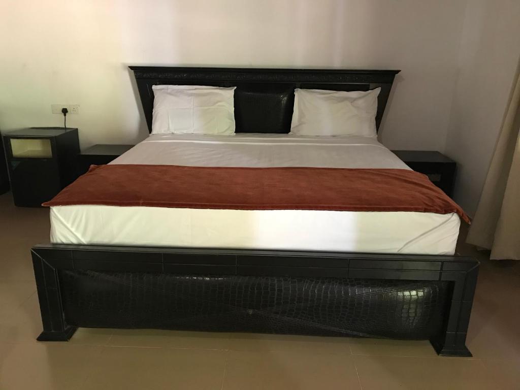 Postel nebo postele na pokoji v ubytování Hotel 4 U Saliya Garden