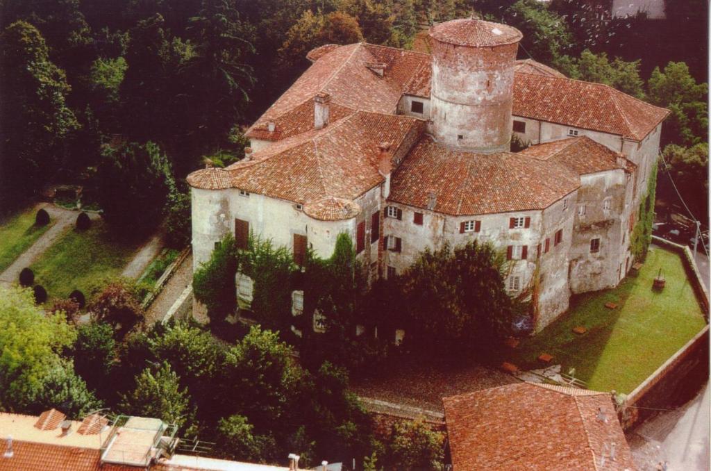 an aerial view of a large building with a tower at Castello di Rocca Grimalda in Rocca Grimalda