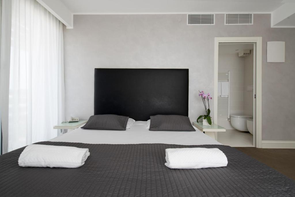 Postel nebo postele na pokoji v ubytování Boutique Hotel Bali