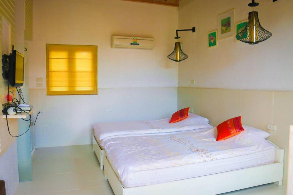 Postel nebo postele na pokoji v ubytování Chez Piera Resort