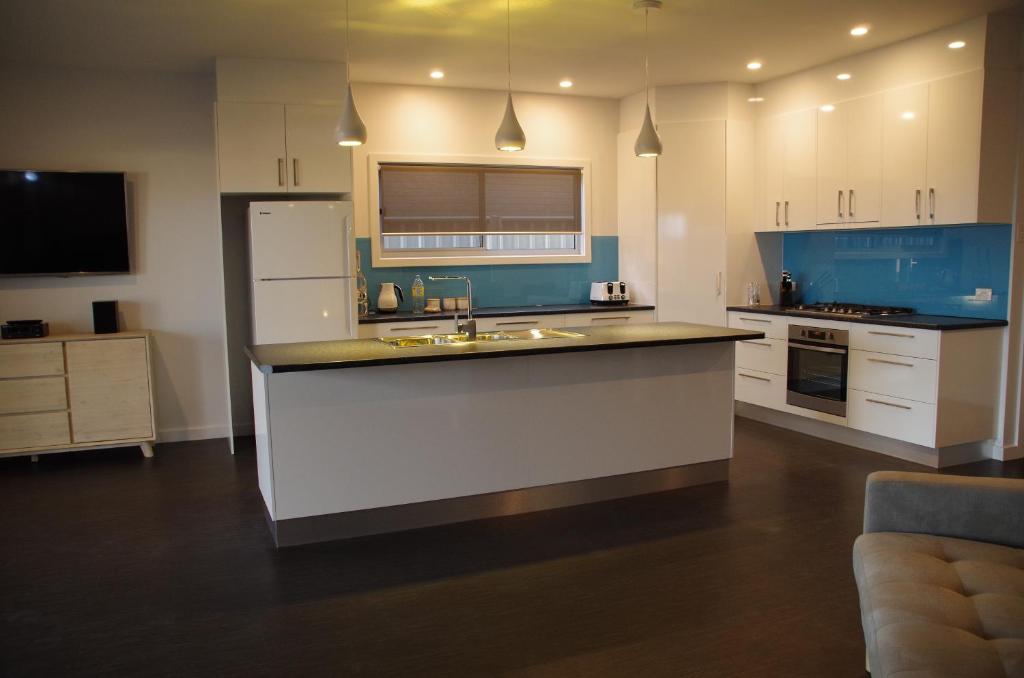 a kitchen with a large island in the middle at Laguna View in Port Lincoln