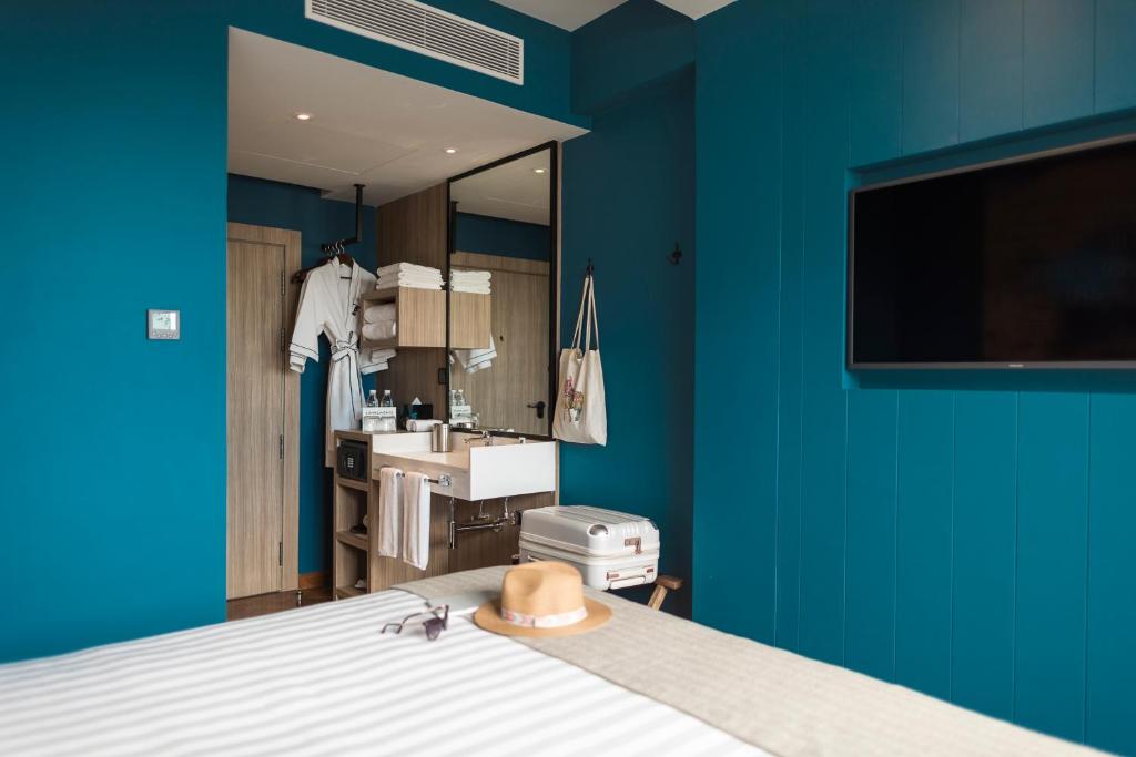 Postel nebo postele na pokoji v ubytování Hotel G Yangon