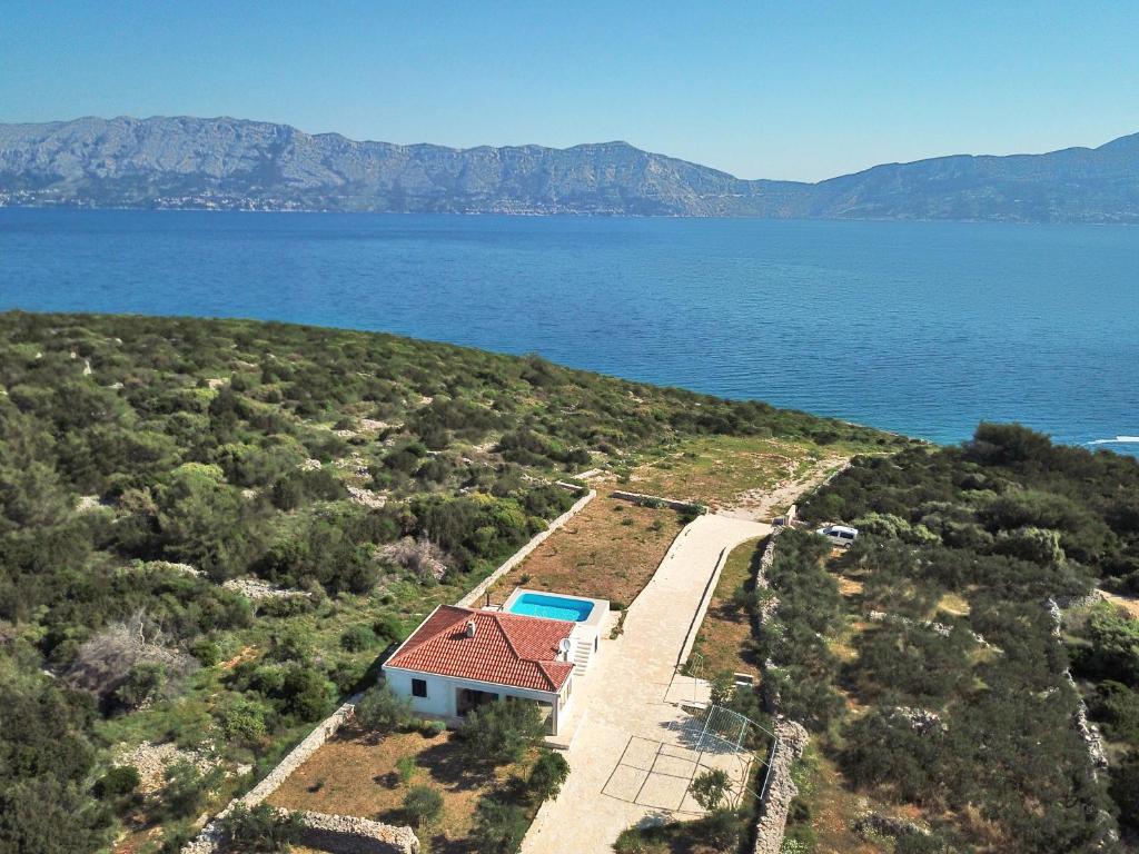 an aerial view of a house on an island in the water at Robinzon Villa Zavala in Povlja