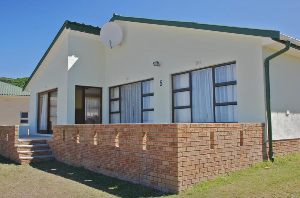 a rendering of a house with a brick wall at Tassies in Gansbaai