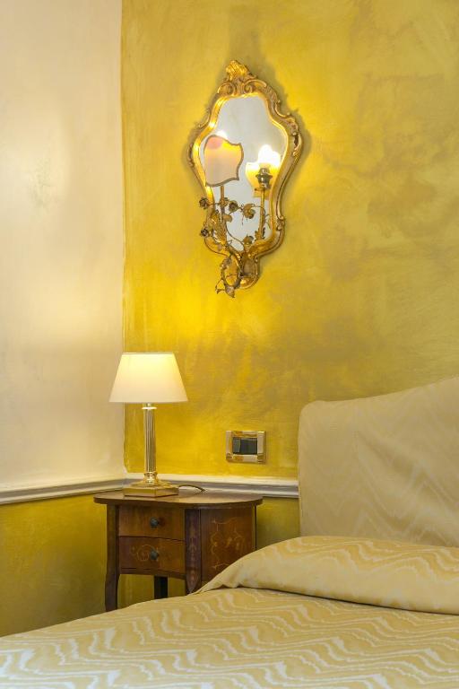 Postel nebo postele na pokoji v ubytování Hotel Pantalon